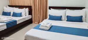 Krevet ili kreveti u jedinici u objektu Kamalig Ng Caraga - Hotel Near SM Mall Butuan powered by Cocotel