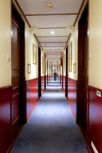 a hallway in a building with a long corridor at Bateau Hotel à quai Le Chardonnay in Avignon