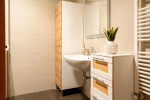 a bathroom with a sink and a mirror at L'ulivo D'oro in Monopoli