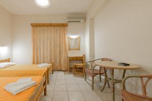 Postel nebo postele na pokoji v ubytování Pink Panther Studios & Apartments