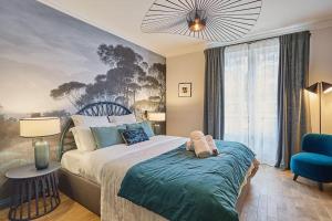 Llit o llits en una habitació de Apartment Notre Dame de Paris by Studio prestige