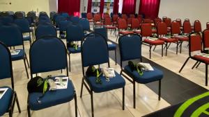 a room filled with blue chairs and tables at Gaborone Hotel in Gaborone