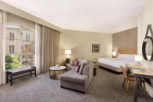 a large hotel room with a bed and a couch at Hyatt Regency Sonoma Wine Country in Santa Rosa