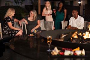 a group of women sitting around a fire pit at Hyatt Regency Sonoma Wine Country in Santa Rosa