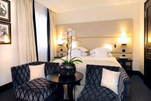 Postel nebo postele na pokoji v ubytování Hôtel Tiffany by Fassbind