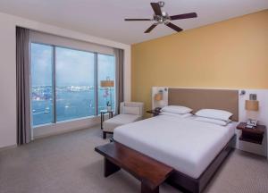 a bedroom with a bed and a large window at Hyatt Regency Cartagena in Cartagena de Indias