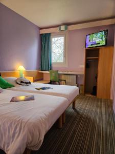 Postel nebo postele na pokoji v ubytování Hotel Bonanite