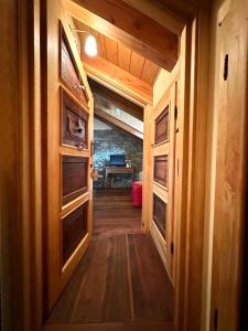 a hallway in a tiny house with a desk at Maison Rosset agriturismo, CAMERE, appartamenti e spa in Valle d'Aosta in Nus