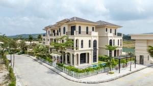 an image of a large white house at The Residence Resort & Villas Phu Quoc in Phu Quoc