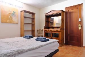 En eller flere senge i et værelse på Casa Magda and Luke