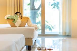 A bed or beds in a room at Hotel Mondial