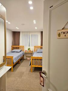 En eller flere senge i et værelse på Recipe