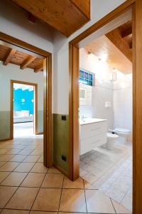 a bathroom with a toilet and a sink at Domus Dea Città Alta in Bergamo