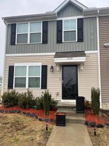 a house with a front door at Cozy Nest: Where Love Blossoms in Nashville +13 photos