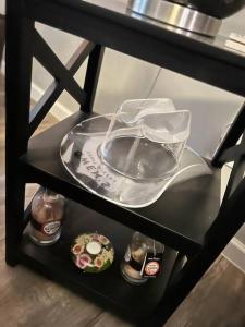 a shelf with a plate and dishes on it at Cozy Nest: Where Love Blossoms in Nashville