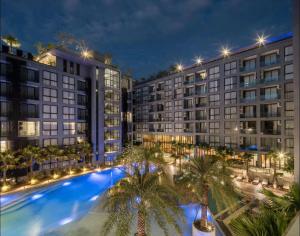 an aerial view of a hotel with palm trees and buildings at Deluxe apartment Citygate Condo by Lofty in Kamala Beach
