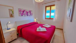 Postel nebo postele na pokoji v ubytování Casa Bentu 'E Mare con vista