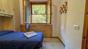 Postel nebo postele na pokoji v ubytování Casa Bentu 'E Mare con vista