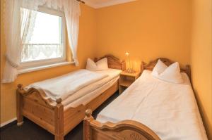 Postel nebo postele na pokoji v ubytování Landhotel Weingut Schulze