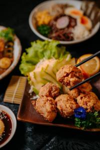 a plate of food with meatballs and vegetables on a table at ICON Venue and Suites in General Santos +12 photos