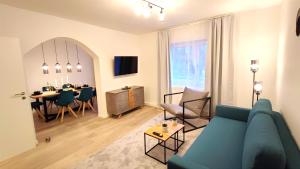 Кът за сядане в Homely Stay - Urban Oasis Apartments