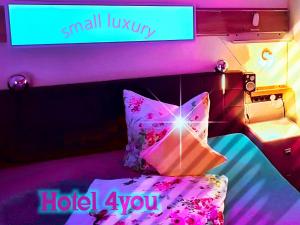 Postel nebo postele na pokoji v ubytování Hotel Garni Rodenbach
