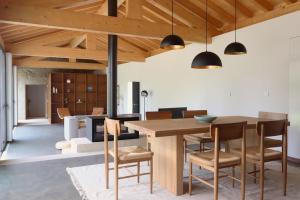 a dining room with a wooden table and chairs at Quinta de Travanca - Casa do Páteo, Baião, Douro in Baião
