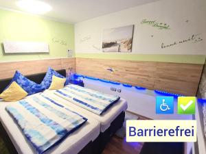 Postel nebo postele na pokoji v ubytování Hotel Garni Rodenbach