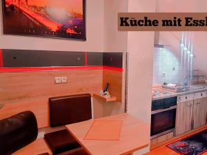 Kuchyň nebo kuchyňský kout v ubytování Hotel Garni Rodenbach