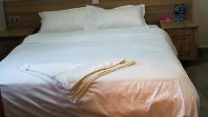 Posteľ alebo postele v izbe v ubytovaní Embu Pazuri Homes