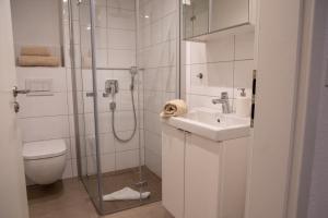 Koupelna v ubytování Haus Seestern + 5 fotografií