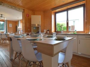 a dining room with a large table and chairs at Spacious Home, Malmedy in Malmedy