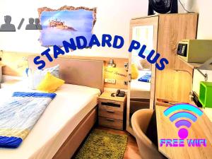 Postel nebo postele na pokoji v ubytování Hotel Garni Rodenbach
