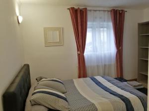 a bedroom with a bed in front of a window at Médina maison 4 chambres 100m2 in Beuvrages