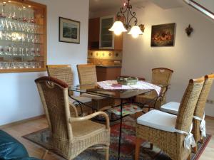 a dining room with a table and chairs at Förster Appartements in Bad Vöslau