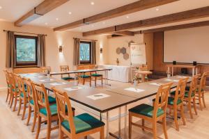 a large conference room with a large table and chairs at Hotel Kaiserhof in Anif