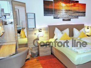 Postel nebo postele na pokoji v ubytování Hotel Garni Rodenbach