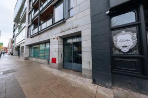 a building with a sign on the side of it at Chic & Radiant 1BD Flat near Dublin City Centre! in Dublin