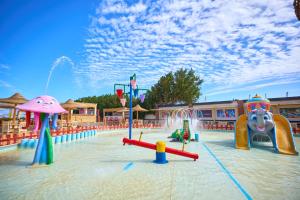a playground with many different types of play equipment at El Karma Beach Resort & Aqua Park - Hurghada in Hurghada