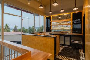 a bar on the balcony of a house at Bedzzz Xclusiv Morjim, Goa By Leisure Hotels in Morjim