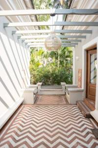 a hallway with a ceiling with a chandelier at Love Story Villas, Baga-Private Pool Villas in Arpora