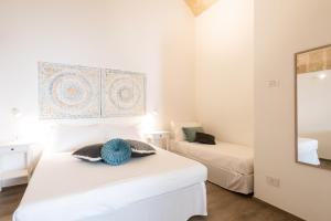 Postel nebo postele na pokoji v ubytování Antiche Volte - Dimore di Charme