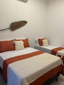 Кровать или кровати в номере Paraíso à Beira-Mar, Touros RN - Acomoda 6 pessoas