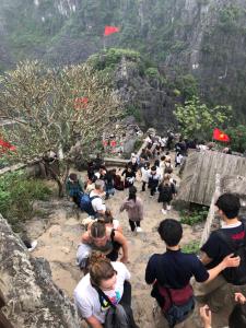 a group of people walking up a mountain at Rosa Garden in Ninh Binh