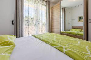 Ένα ή περισσότερα κρεβάτια σε δωμάτιο στο DOMINO