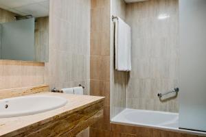 a bathroom with a sink and a shower at Prinsotel Alba & Spa in Cala d´Or