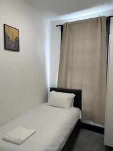 Postel nebo postele na pokoji v ubytování Ivy House Hotel