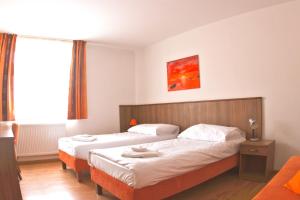 Postel nebo postele na pokoji v ubytování Hotel Kácov