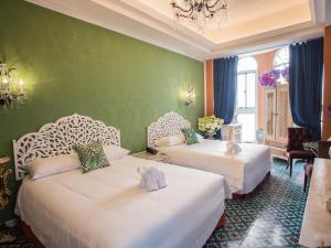 Ένα ή περισσότερα κρεβάτια σε δωμάτιο στο Anna King Hotel