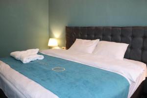 Letto o letti in una camera di Belona Hotel